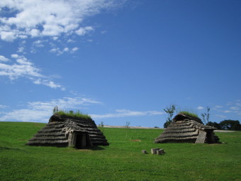 Restored pit dwellings at the Kitakogane Shell Midden